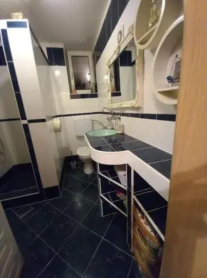 a bathroom with a sink and a toilet at Nice Apartment near by Capital of Slovenia in Ljubljana