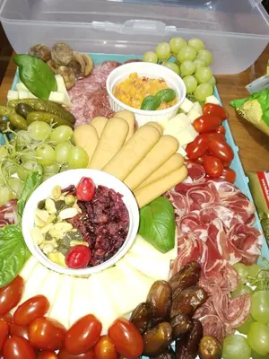 a tray filled with different types of vegetables and fruits at Nice Apartment near by Capital of Slovenia in Ljubljana