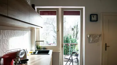 a kitchen with a sink and a window at Central apartment great for couples or small families in Ljubljana