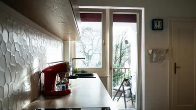 a kitchen with a red mixer on a counter at Central apartment great for couples or small families in Ljubljana