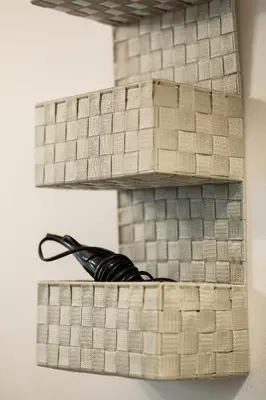 a wooden shelf with a pair of scissors on it at Central apartment great for couples or small families in Ljubljana