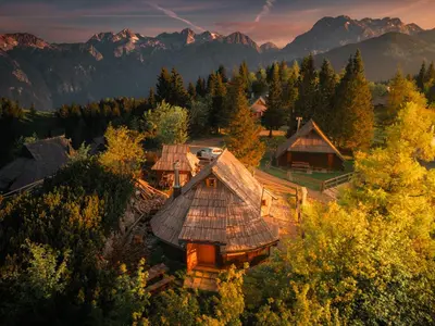 an aerial view of a house in the mountains at Koča Kronca - Velika planina in Stahovica
