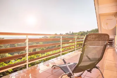 a chair sitting on a balcony with a view at Holiday home in Mirna Kranjska Krain 36158 in Mirna