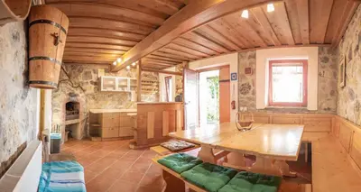 a kitchen with a large wooden table in a room at Holiday home in Mirna Kranjska Krain 36158 in Mirna