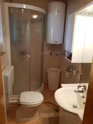 a bathroom with a shower and a toilet and a sink at Holiday home in Mirna Kranjska Krain 36158 in Mirna
