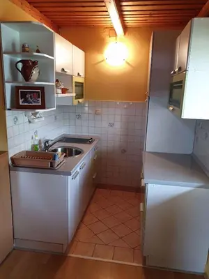 a small kitchen with a sink and a refrigerator at Holiday home in Mirna Kranjska Krain 36158 in Mirna