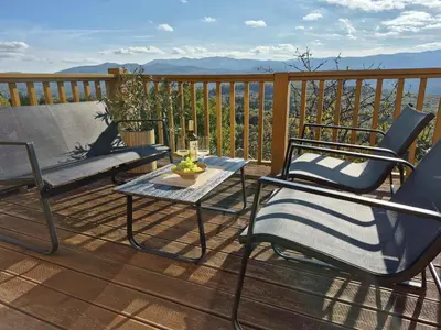 two chairs and a table on a deck with a view at Holiday home in Drganja sela Kranjska Krain 42002 in Drganja Sela
