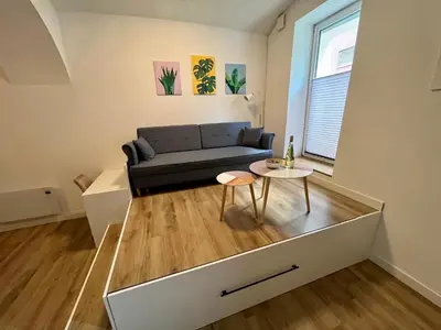 a living room with a couch and a table at Apartment TiSa, Ljubljana in Ljubljana