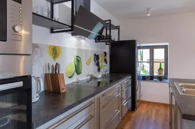 a kitchen with a sink and a counter top at Villa Richterberg with Sauna & Hot Tub in Slovenj Gradec