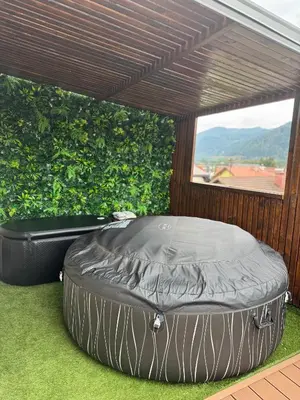 a largelatablelatable bed sitting on the grass at Apartma LIMA in Mozirje
