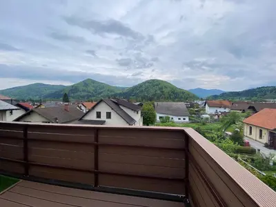 a view of a town from the roof of a house at Apartma LIMA in Mozirje
