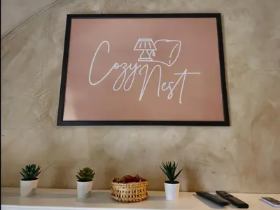 a picture of a sign that says cozy next on a wall at Cozy Nest in Ljubljana