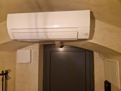 a computer monitor on a ceiling in a room at Cozy Nest in Ljubljana