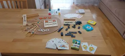 a table with some toys on top of a wooden floor at Apartma Vita in Moravske Toplice