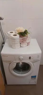 a washing machine with two baskets on top of it at Apartma Vita in Moravske Toplice