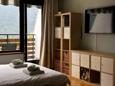 a bedroom with a bed with towels on it at Apartment Vita in Bovec