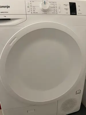 a white washing machine with its door open at Brasilia apartment in Ljubljana
