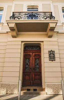 a wooden door on the side of a building at Grossmann Apartment in Ljutomer