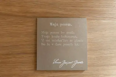 a piece of paper with writing on a table at Apartma Jenkova rezidenca in Kranj