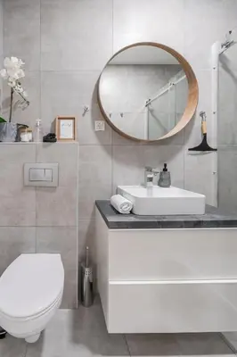 a bathroom with a white sink and a mirror at Classy & Cozy apartment 2 in Ljubljana
