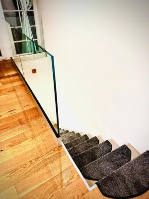 a set of stairs in a room with a glass case at Krakovska apartments in Ljubljana