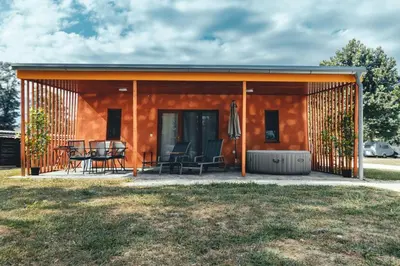 a rendering of a tiny house with a patio at Terme Banovci - Mobilne hiške Med Brajdami in Banovci