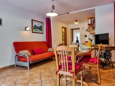 a living room with a couch and a table at Apartmaji Jakob 1 in Bovec