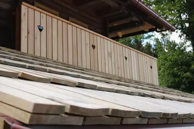 a stack of wooden steps in front of a building at APARTMA BREST in Gornji Grad