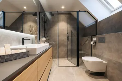 a bathroom with a shower and a toilet and a sink at Ambient Resort Bled in Bled