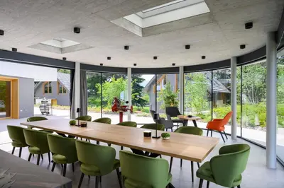 a dining room with a large table and chairs at Ambient Resort Bled in Bled