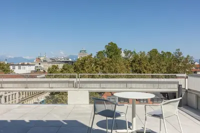 a table and two chairs sitting on a roof at Occidental Ljubljana in Ljubljana