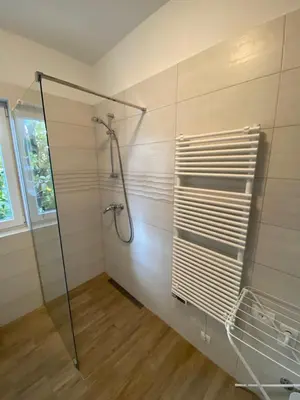 a bathroom with a shower with a glass door at Apartma Magnolija in Nova Gorica