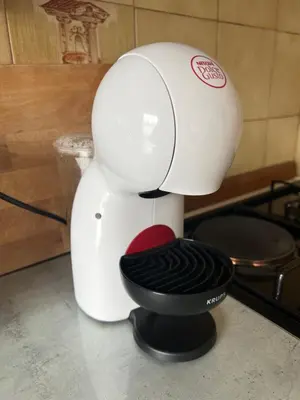 a white mixer sitting on top of a counter at Apartma Magnolija in Nova Gorica