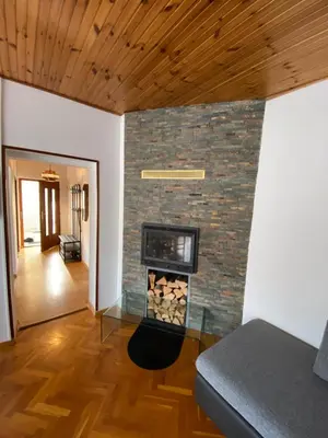 a fireplace in a room with a brick wall at Apartma Magnolija in Nova Gorica
