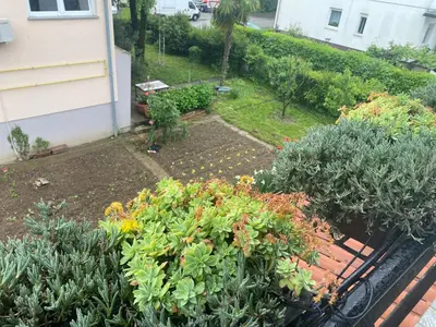an aerial view of a garden with flowers and plants at Apartma Magnolija in Nova Gorica