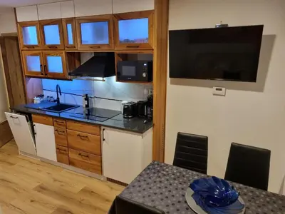 a kitchen with a sink and a counter top at Savinja River Residence in Ljubno