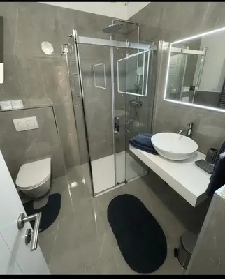 a bathroom with a shower and a toilet and a sink at Belavita in Bovec