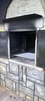 an outdoor brick oven with avertisementatronatronstrationstrationstrationstrationstrationstrationstration at Cottage near river Kolpa, vineyards,top location. in Adlešiči