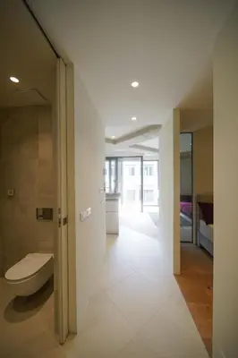 a bathroom with a toilet and a sink in a room at Castle View Luxury Suite in Ljubljana
