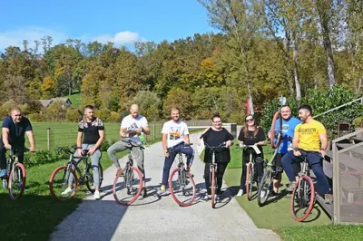 a group of people posing for a picture on their bikes at Glamping Lucky House in Gradac
