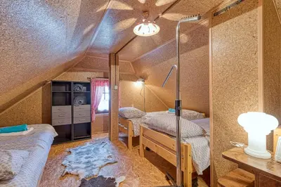 a room with three beds in a room at Vineyard Cottage Vesna Lake View - Happy Rentals in Veliki Vrh