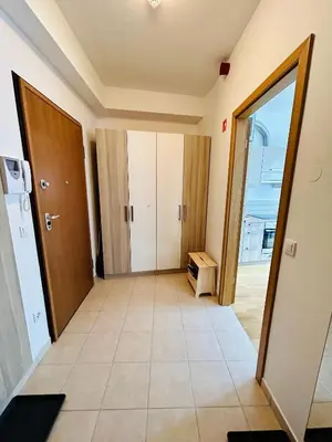 a corridor of a room with a door and a room with a floor at Pohorske terase Gabi in Pohorje