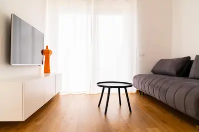 a living room with a couch and a table at Hiša ob stolpu in Lendava