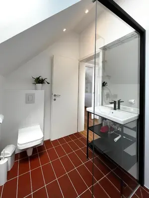 a bathroom with a sink and a toilet at Hiša ob stolpu in Lendava