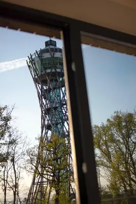 a view of the eiffel tower through a window at Hiša ob stolpu in Lendava