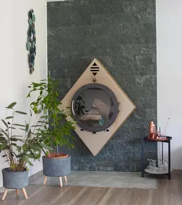 a room with two potted plants on a wall at Guest house TOMAN in Bled
