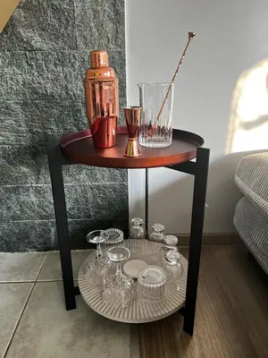 a small table with glasses and a blender on it at Guest house TOMAN in Bled