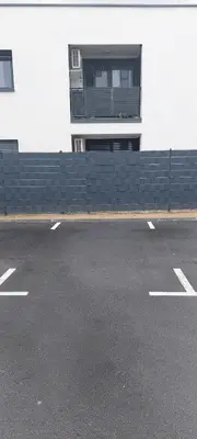 a parking lot in front of a building at LA Studio in Maribor