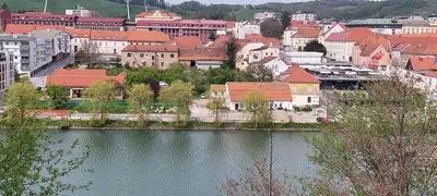 a view of a city with a river and buildings at LA Studio in Maribor