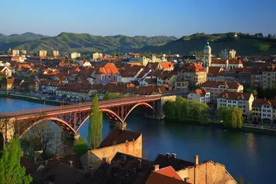 a city with a bridge over a river with buildings at LA Studio in Maribor